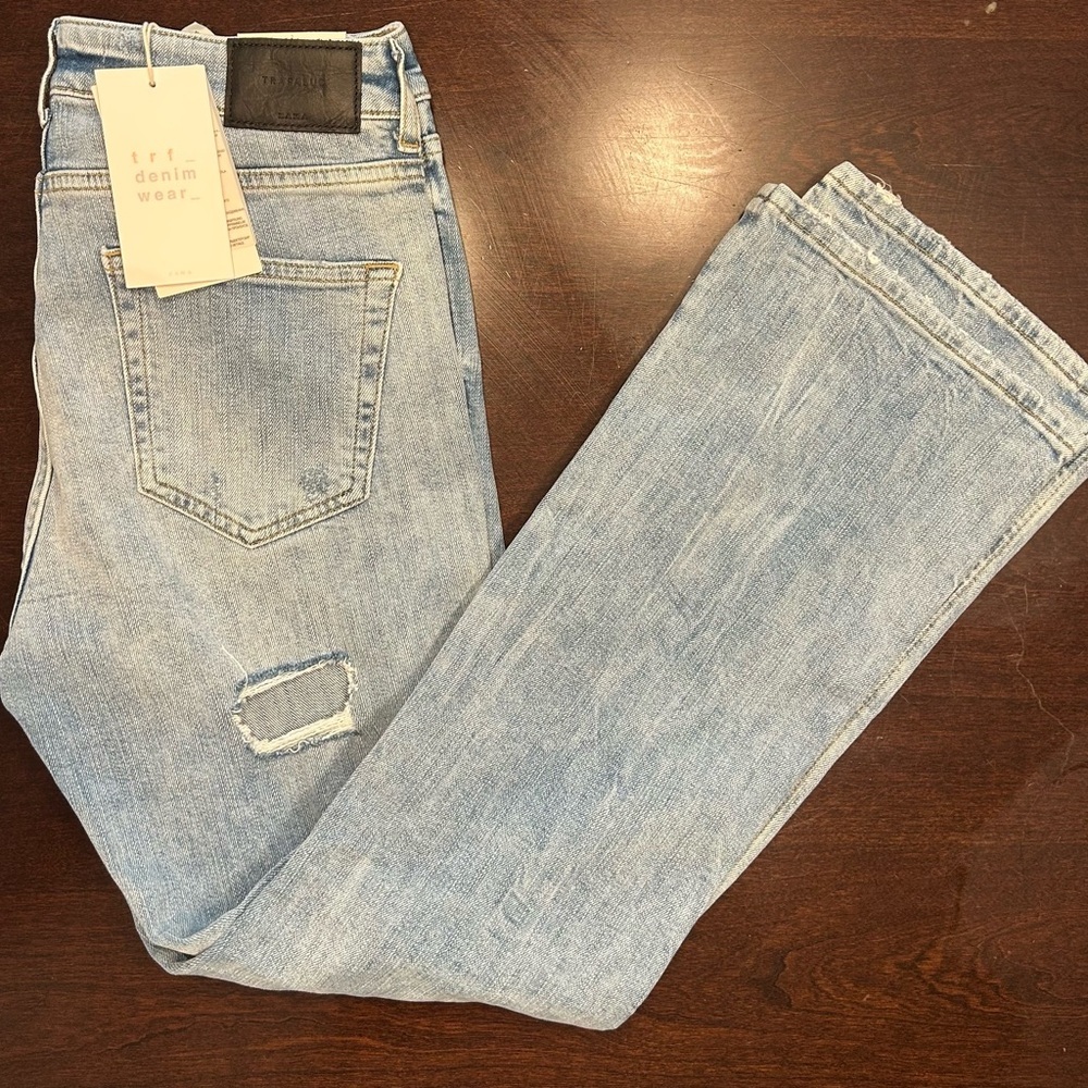 Zara Light Blue Denim Jeans with Black Leather Patch